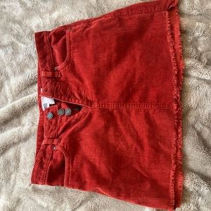 Orange corduroy mini skirt.